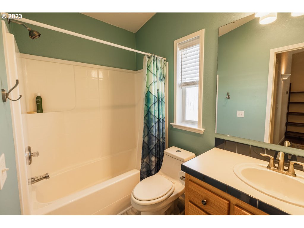 369 Gun Club Road, Unit 16 Woodland, WA 98674 - Photo 28 of 44 a bathroom with a sink toilet and shower