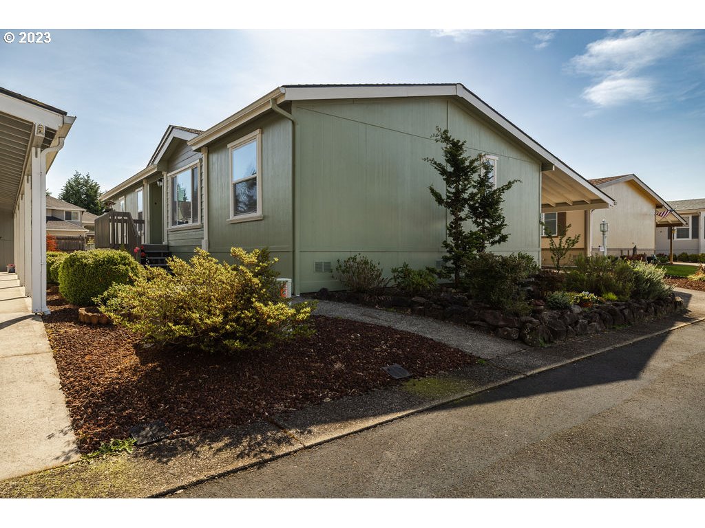 369 Gun Club Road, Unit 16 Woodland, WA 98674 - Photo 3 of 44 a front view of a house with garden