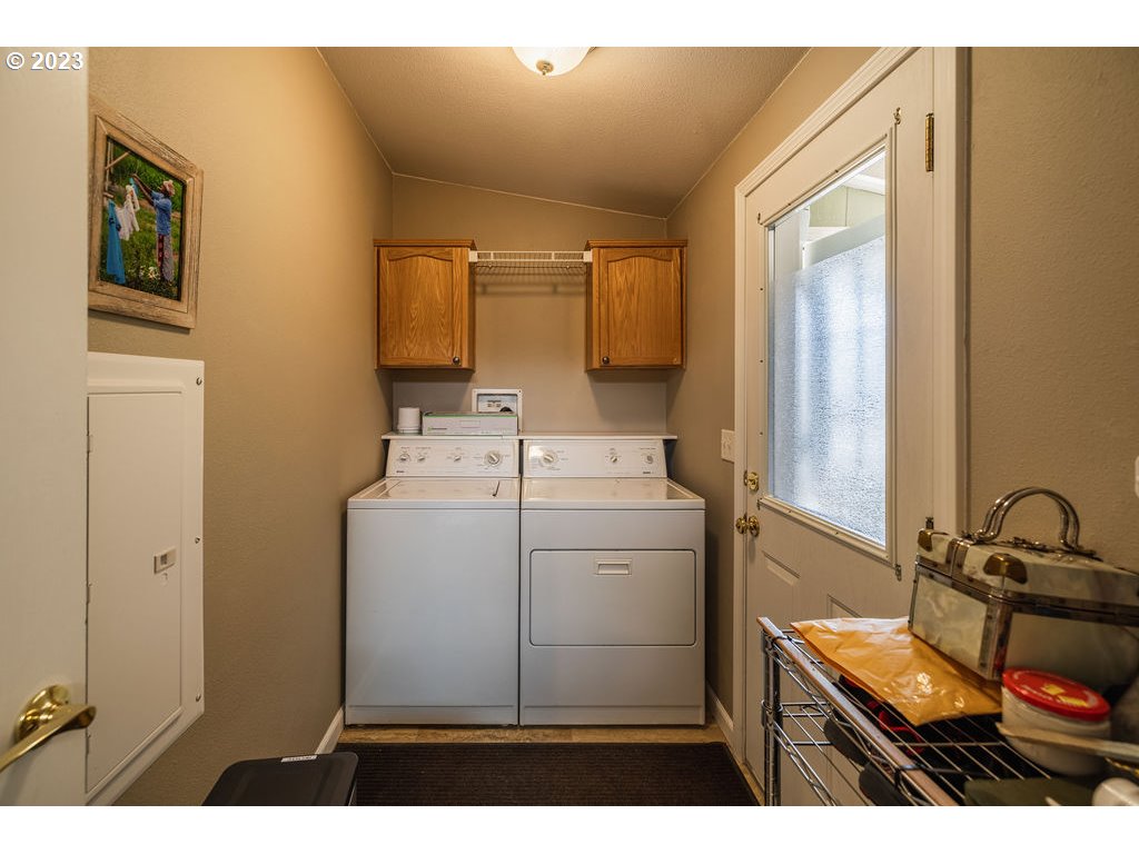 369 Gun Club Road, Unit 16 Woodland, WA 98674 - Photo 31 of 44 a utility room with dryer and washer