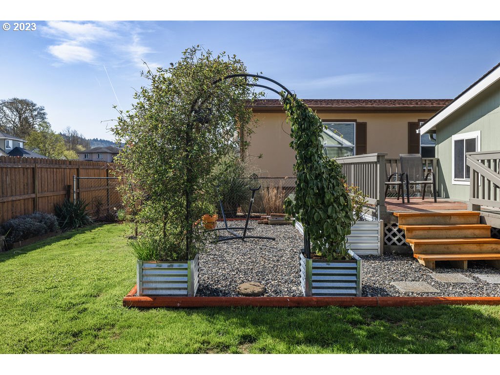 369 Gun Club Road, Unit 16 Woodland, WA 98674 - Photo 36 of 44 a front view of a house with a garden