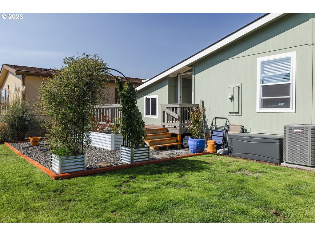 369 Gun Club Road, Unit 16 Woodland, WA 98674 - Photo 38 of 44 a view of a house with backyard and sitting area