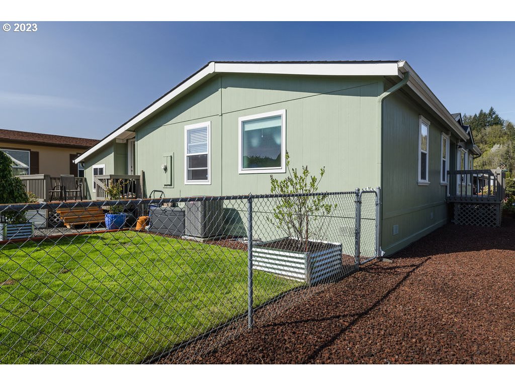 369 Gun Club Road, Unit 16 Woodland, WA 98674 - Photo 39 of 44 a house view with a garden space