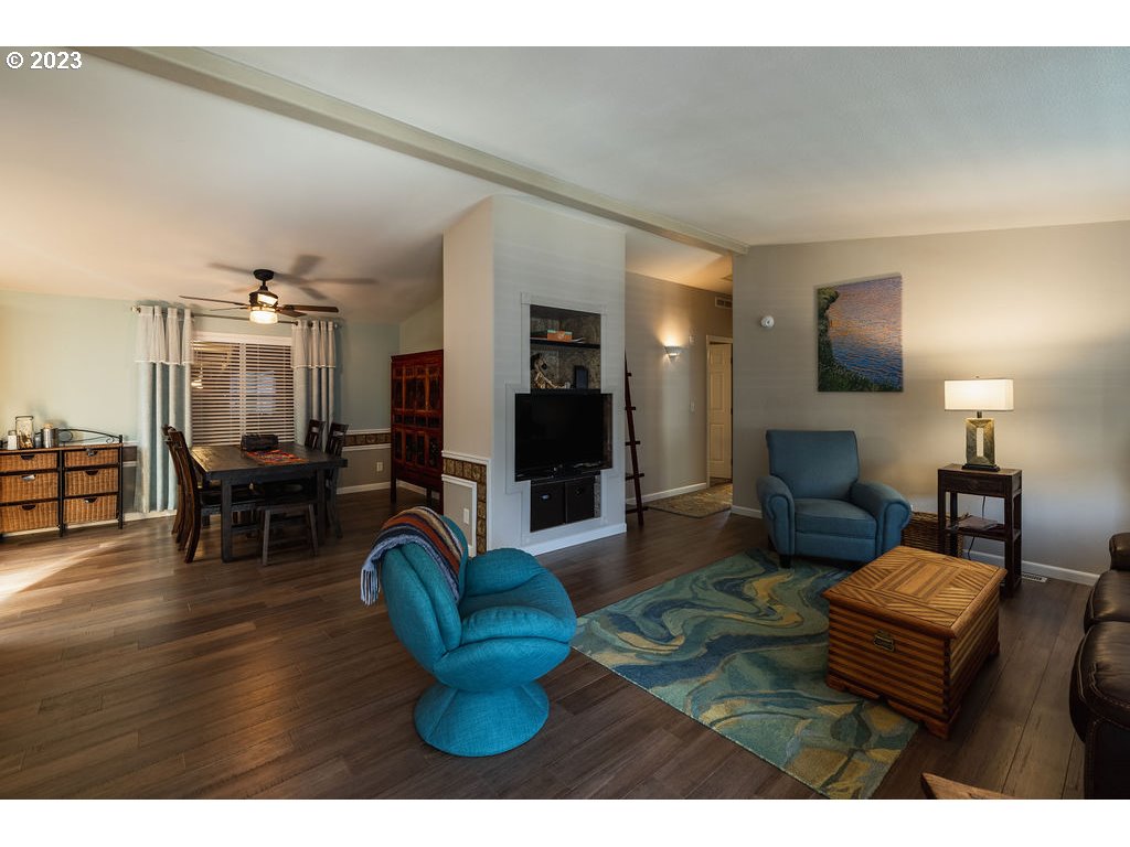 369 Gun Club Road, Unit 16 Woodland, WA 98674 - Photo 7 of 44 a living room with furniture and a wooden floor