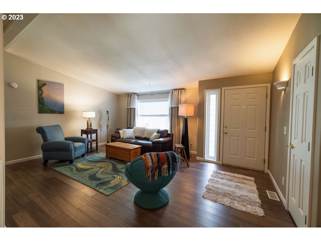 369 Gun Club Road, Unit 16 Woodland, WA 98674 - Photo 9 of 44 a living room with furniture and a wooden floor