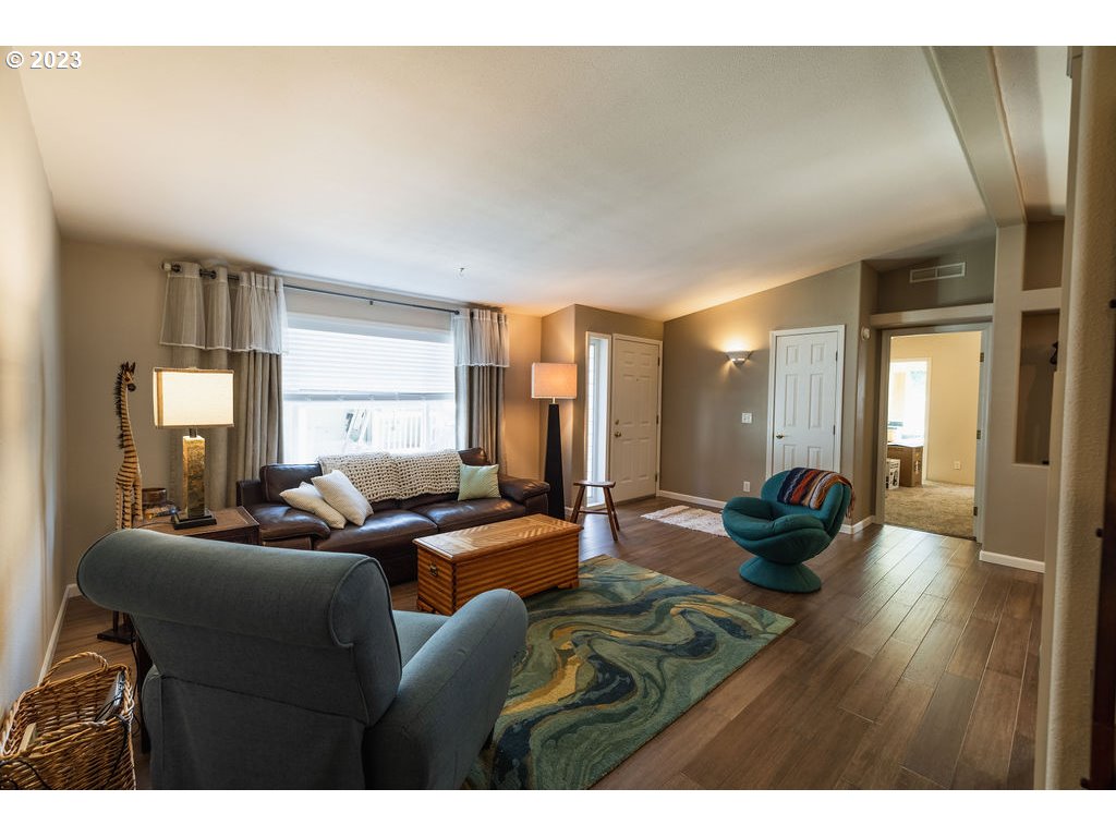 369 Gun Club Road, Unit 16 Woodland, WA 98674 - Photo 10 of 44 a living room with furniture and a large window