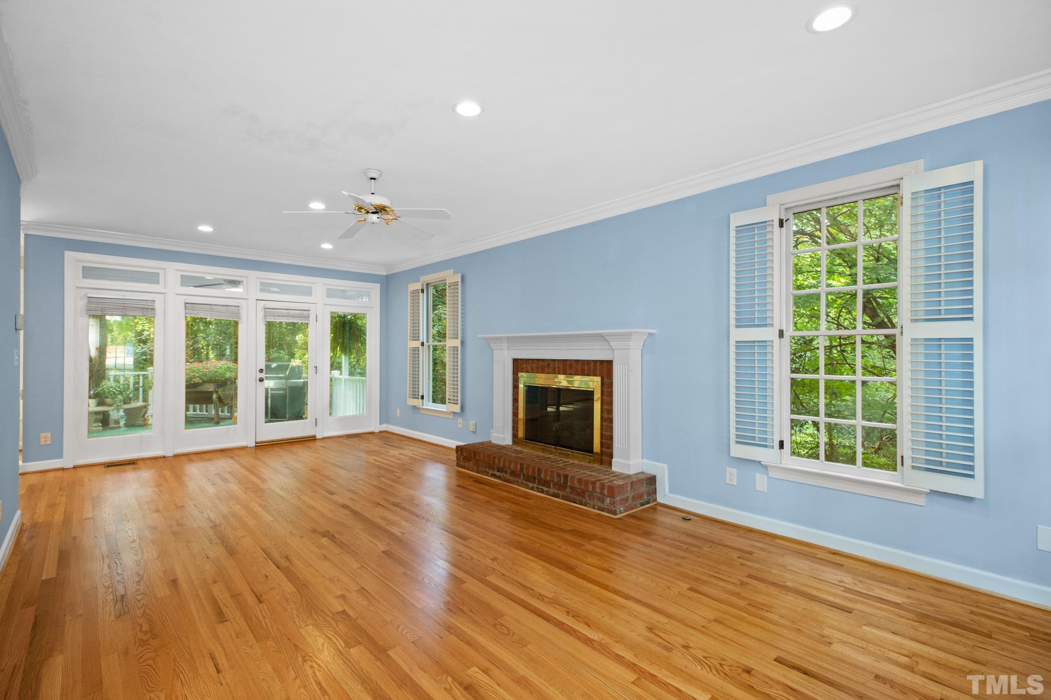 1205 Weldon Place Raleigh, NC 27608 - Photo 17 of 33 a view of an empty room with wooden floor and a window