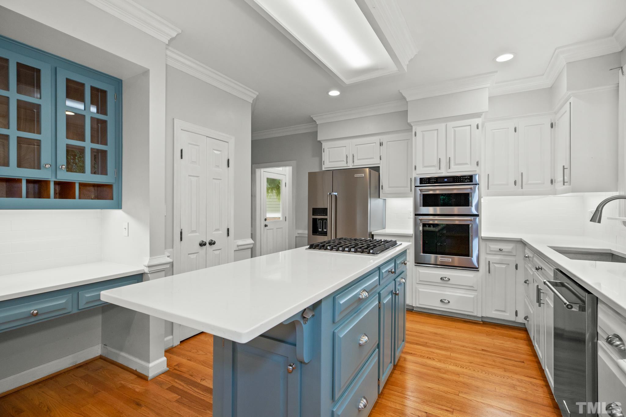 1205 Weldon Place Raleigh, NC 27608 - Photo 20 of 33 a kitchen with a sink stove and refrigerator