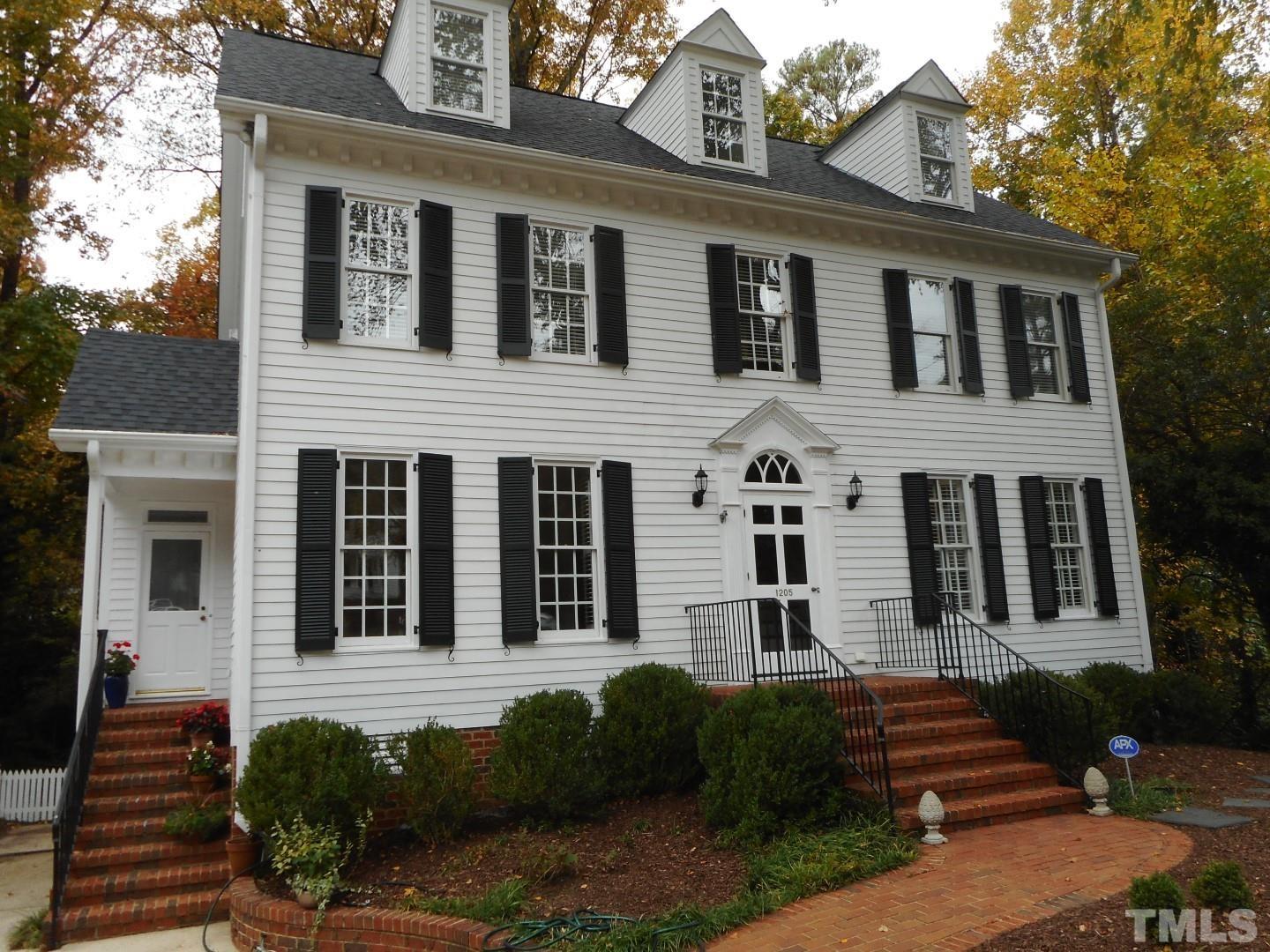 1205 Weldon Place Raleigh, NC 27608 - Photo 2 of 33 a front view of a house with yard and parking