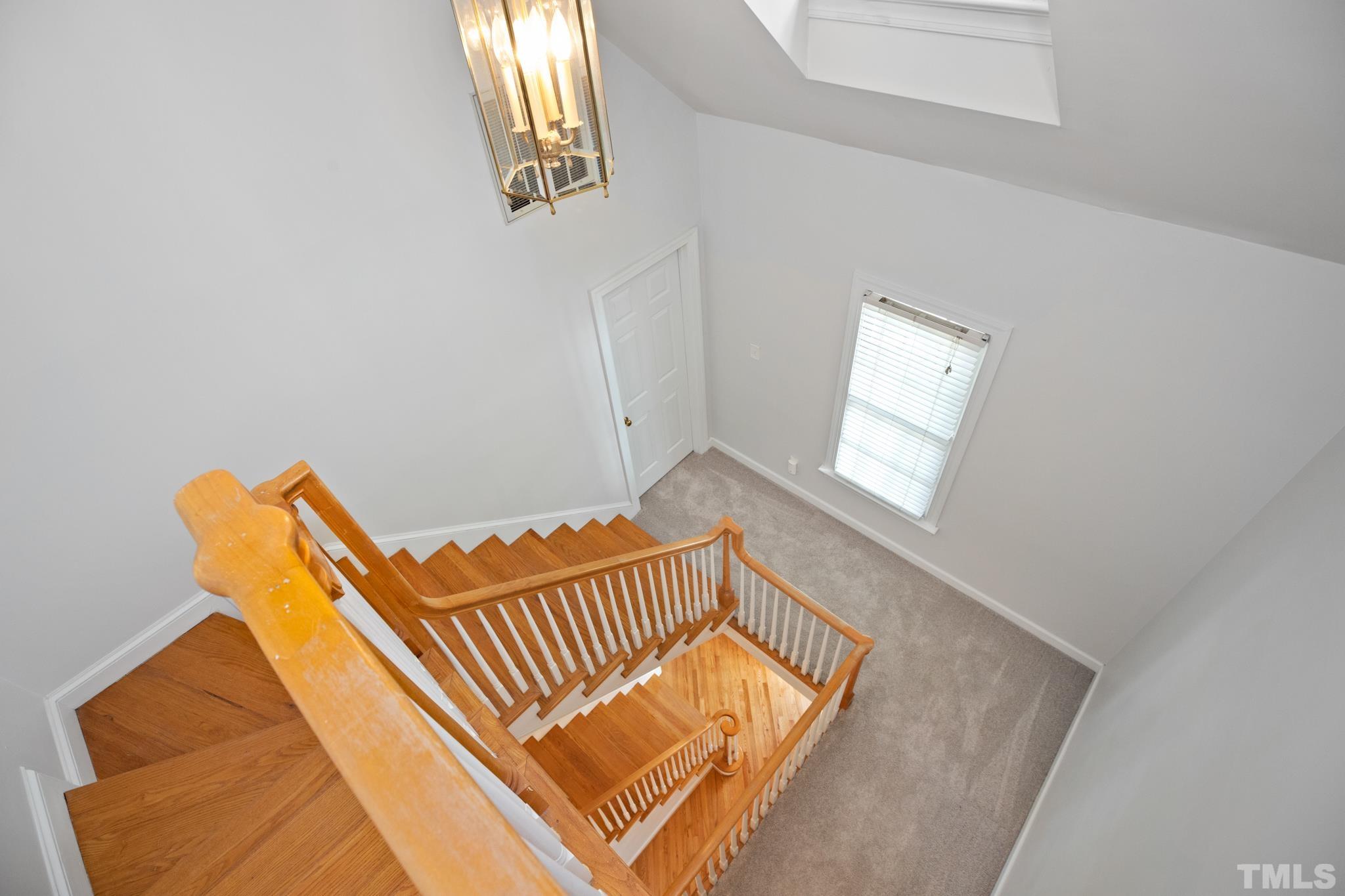 1205 Weldon Place Raleigh, NC 27608 - Photo 25 of 33 a view of wooden floor and windows in a room