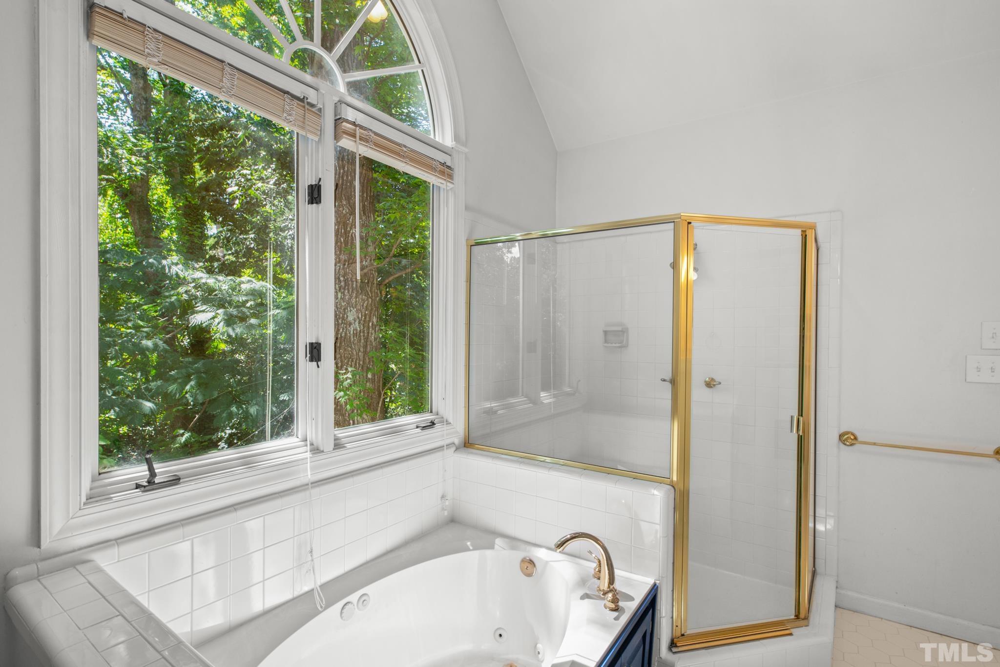 1205 Weldon Place Raleigh, NC 27608 - Photo 29 of 33 a bathroom with a bathtub and a shower
