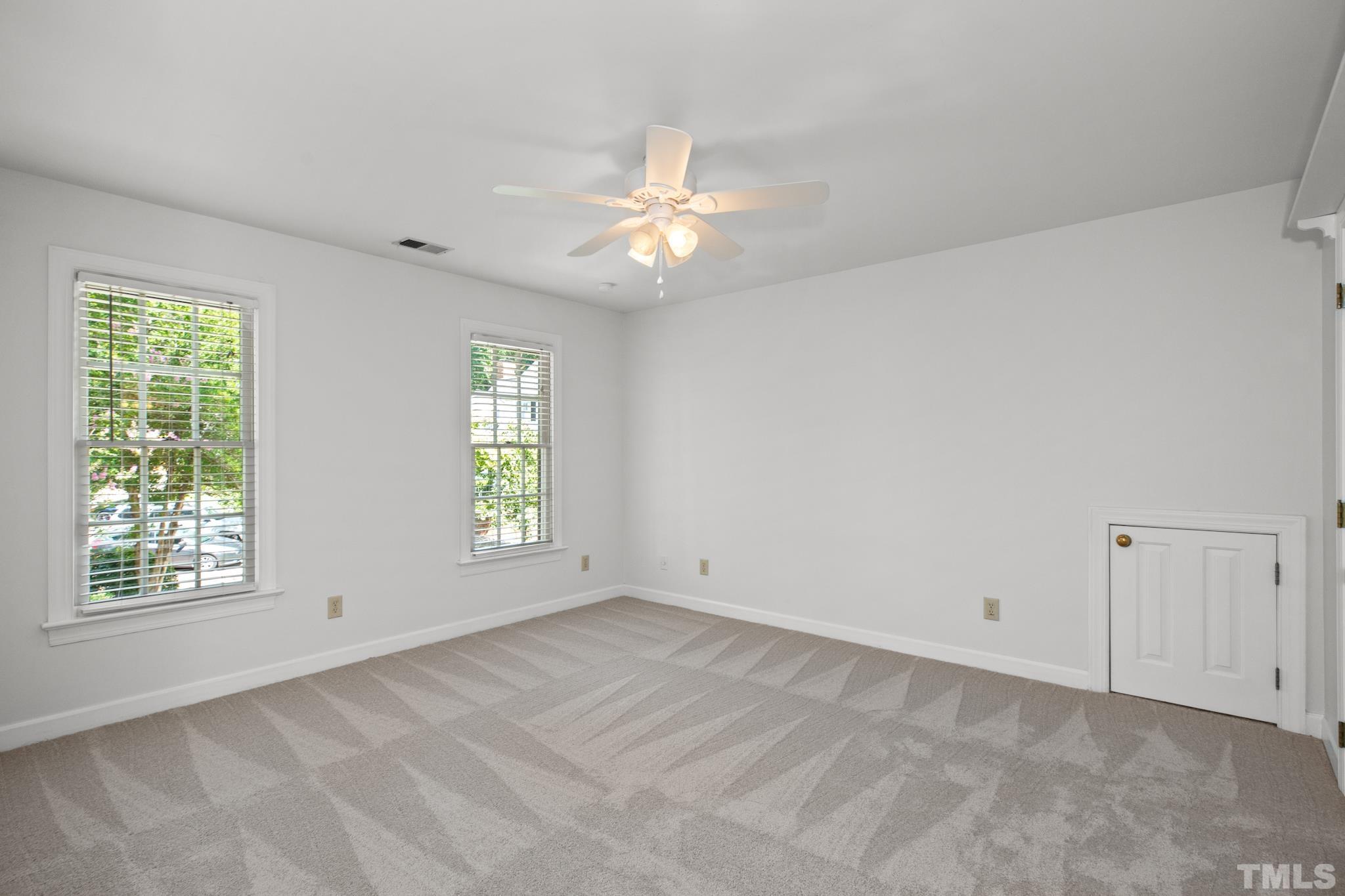 1205 Weldon Place Raleigh, NC 27608 - Photo 30 of 33 a view of an empty room with window and chandelier fan