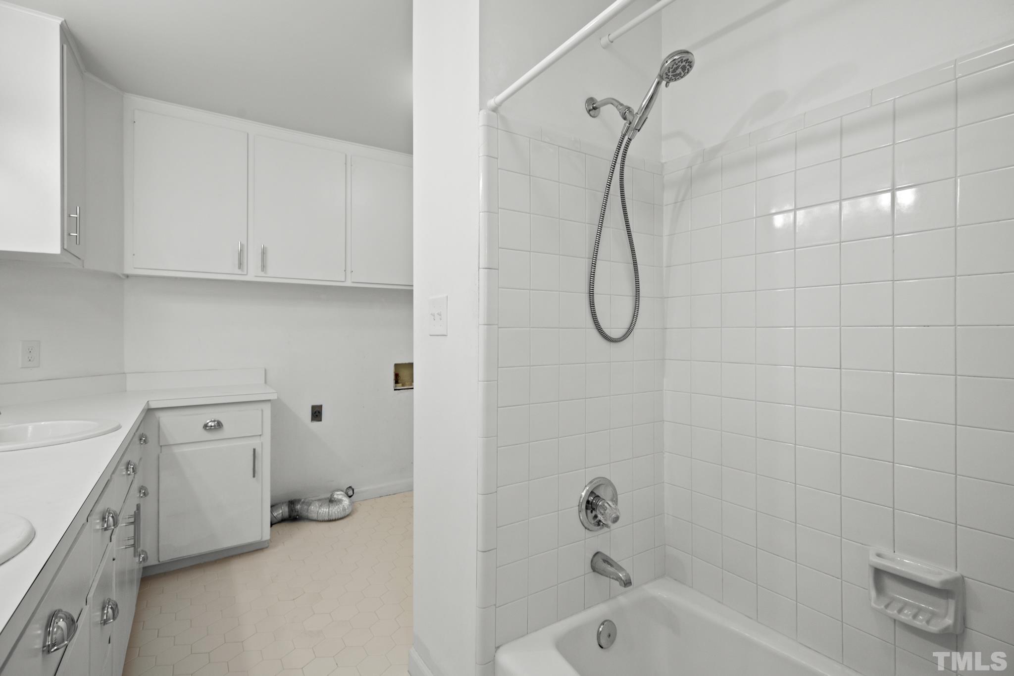 1205 Weldon Place Raleigh, NC 27608 - Photo 32 of 33 a bathroom with a tub a toilet and a shower