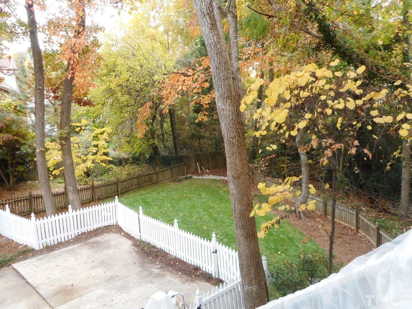 1205 Weldon Place Raleigh, NC 27608 - Photo 8 of 33 a view of a yard with plants and trees