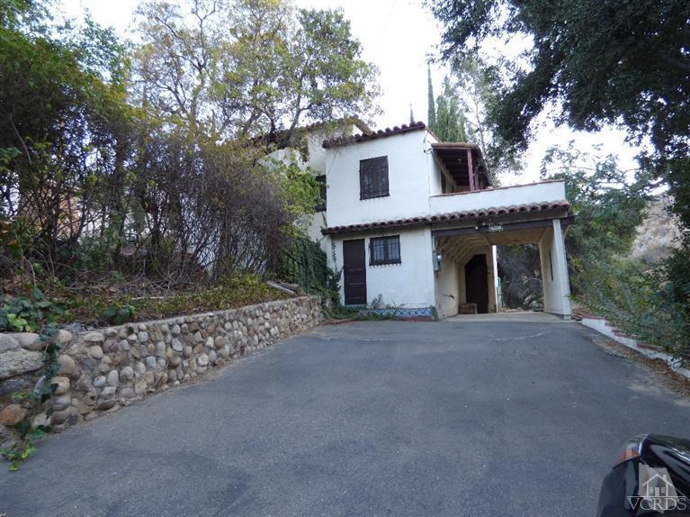 952 Riess Road Simi Valley, CA 93063 - Photo 22 of 25 a front view of a house with a garden
