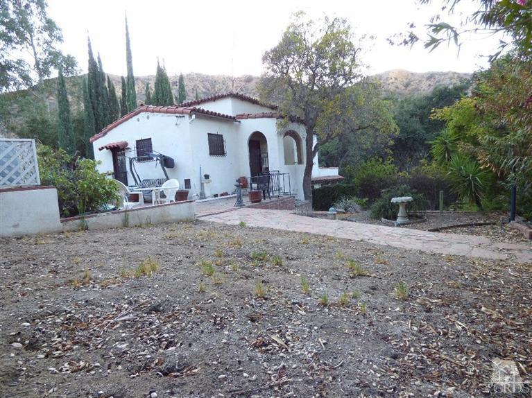 952 Riess Road Simi Valley, CA 93063 - Photo 9 of 25 a view of a house with backyard and trees