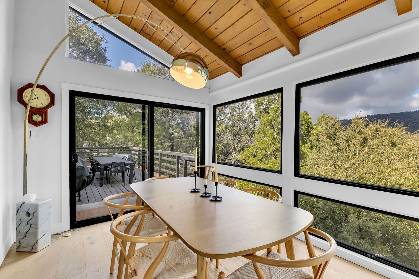 53010 Inspiration Lane Idyllwild, CA 92549 - Photo 25 of 91 a view of a dining room with furniture large windows and wooden floor