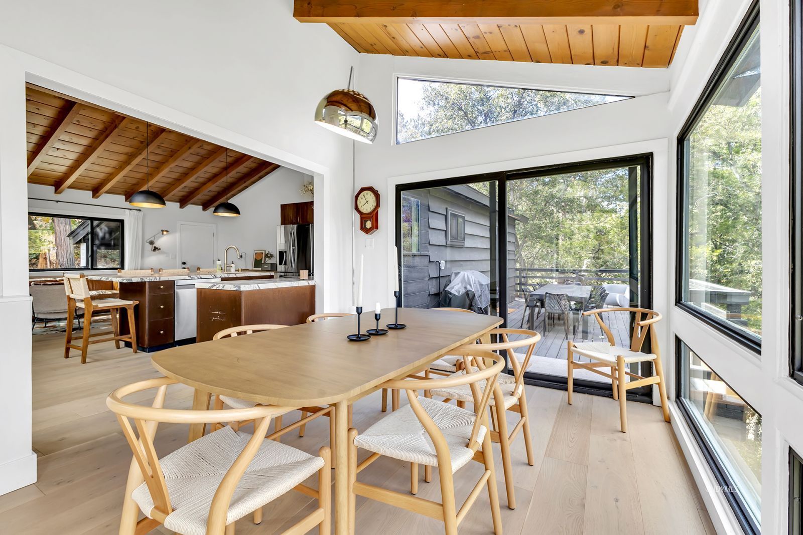 53010 Inspiration Lane Idyllwild, CA 92549 - Photo 28 of 91 a view of a dining room with furniture large windows and wooden floor