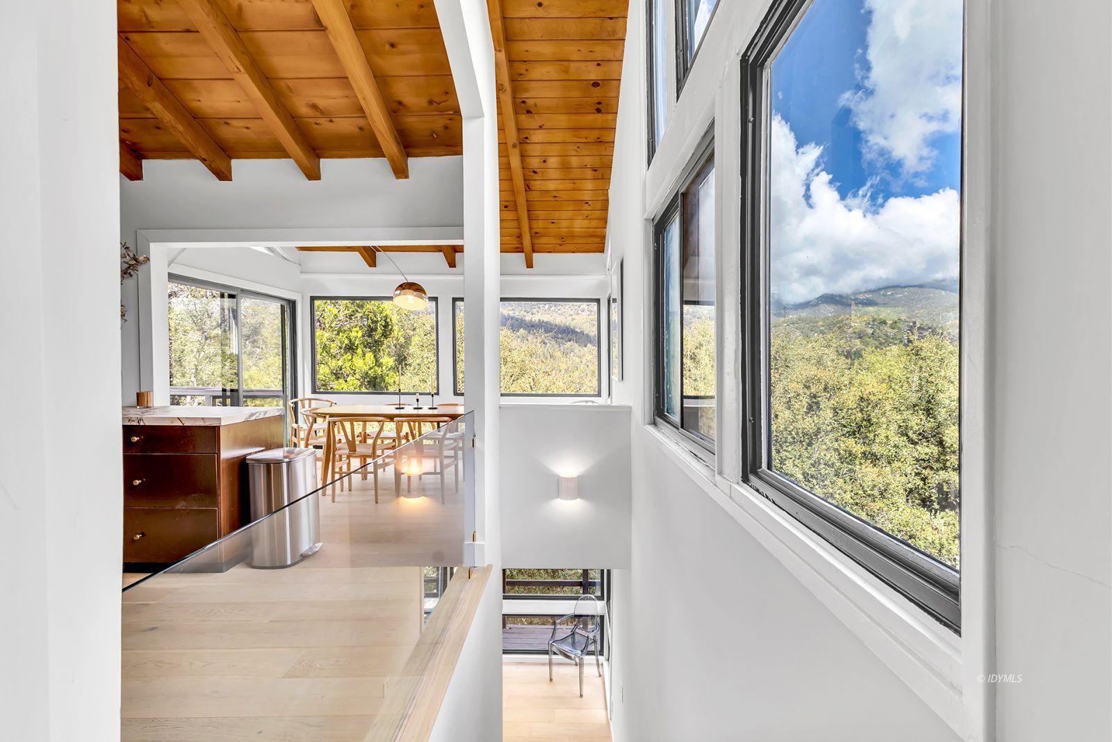 53010 Inspiration Lane Idyllwild, CA 92549 - Photo 50 of 91 a view of a living room with a floor to ceiling window and wooden floor