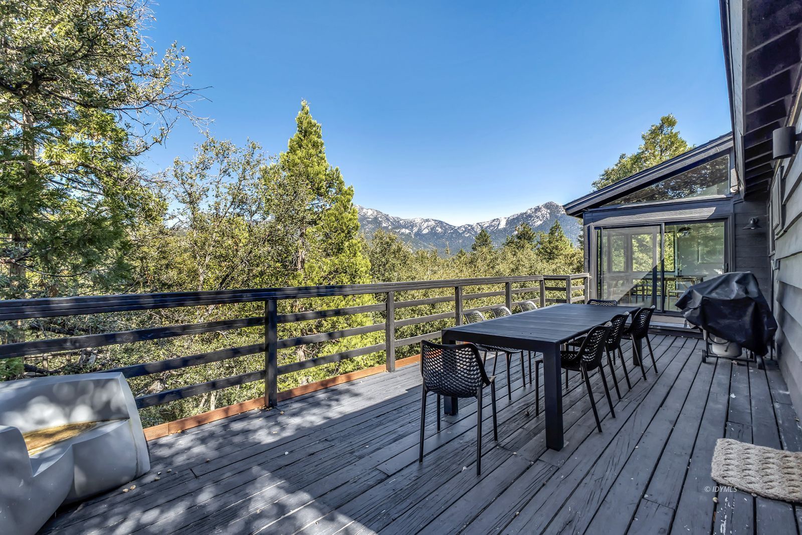 53010 Inspiration Lane Idyllwild, CA 92549 - Photo 5 of 91 a view of a chairs and table on the wooden deck