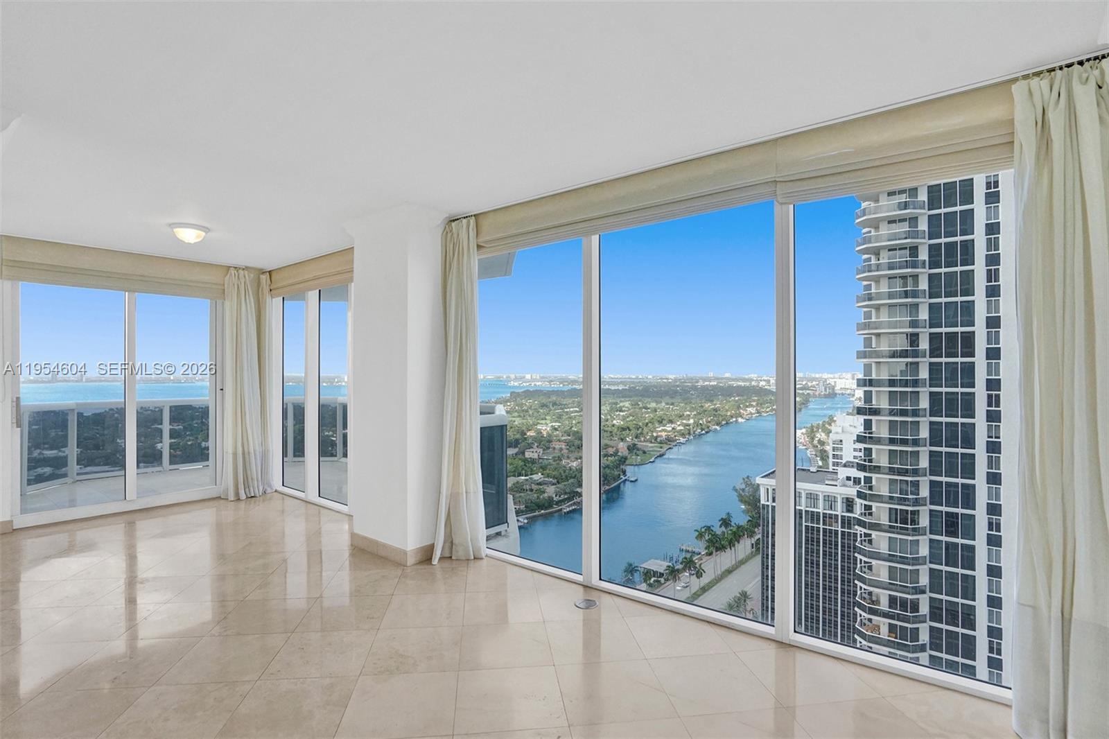 4775 Collins Avenue, Unit 3007 Miami Beach, FL 33140 - Photo 18 of 60 a view of an empty room with a window