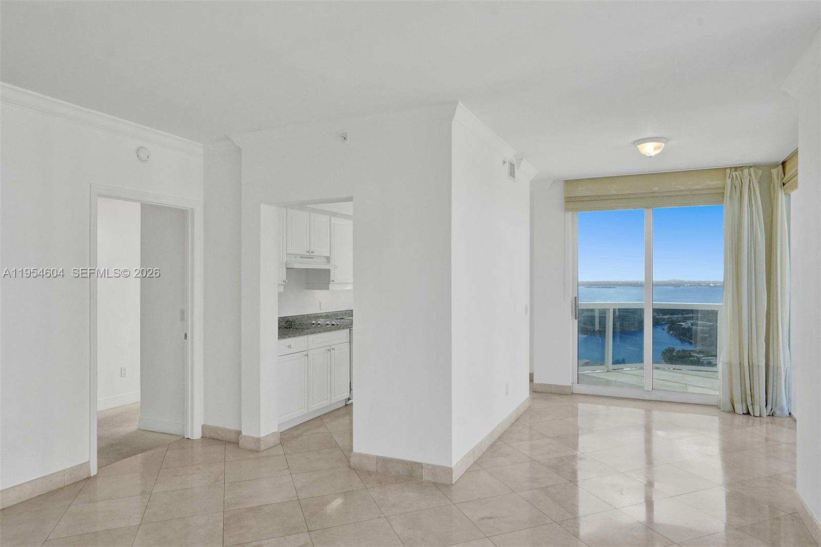 4775 Collins Avenue, Unit 3007 Miami Beach, FL 33140 - Photo 21 of 60 a view of an empty room with a window