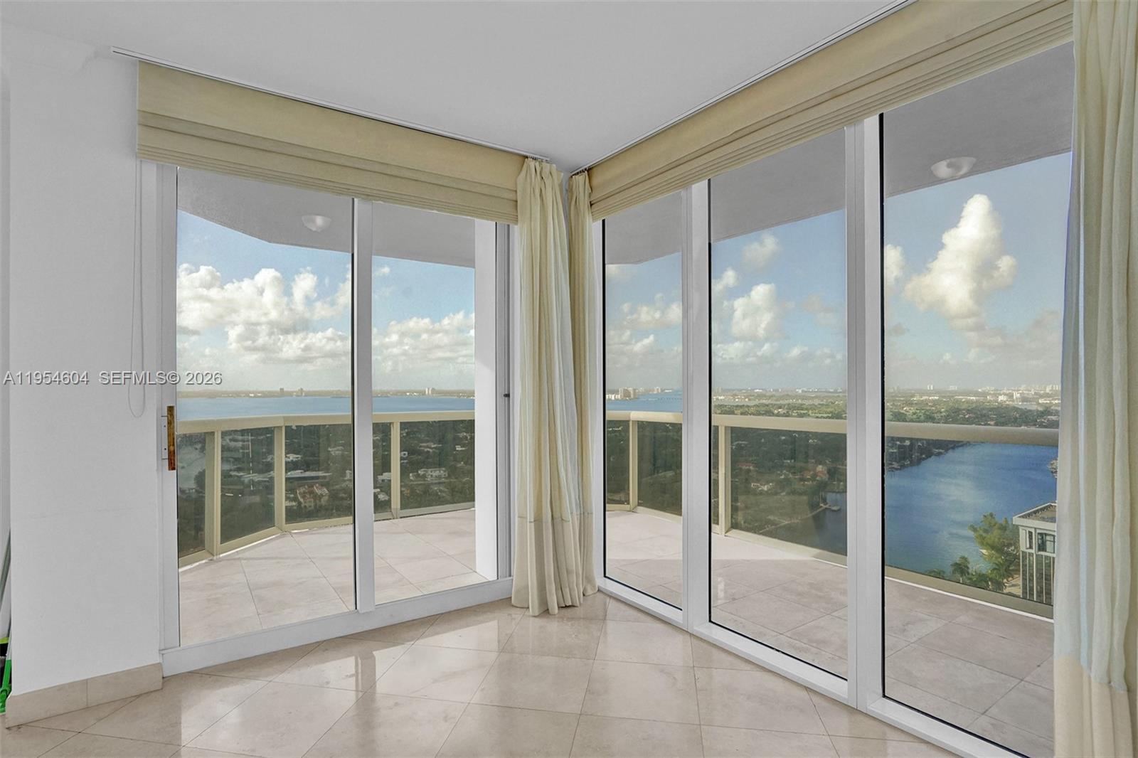 4775 Collins Avenue, Unit 3007 Miami Beach, FL 33140 - Photo 22 of 60 a view of a room that has a glass door
