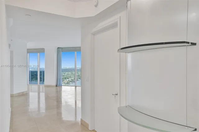 a kitchen with granite countertop a sink and cabinets