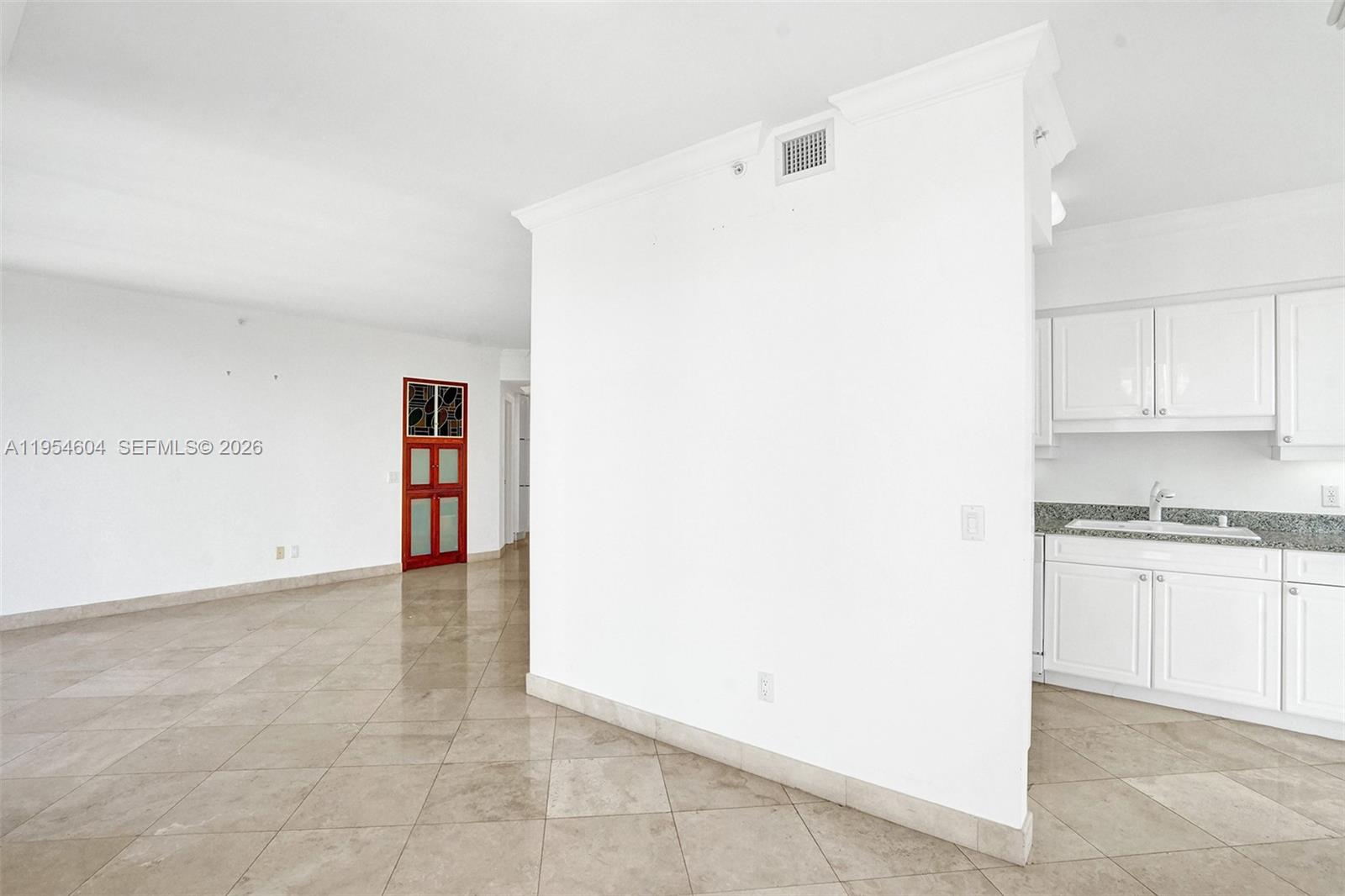 4775 Collins Avenue, Unit 3007 Miami Beach, FL 33140 - Photo 24 of 60 a view of kitchen with refrigerator and cabinets