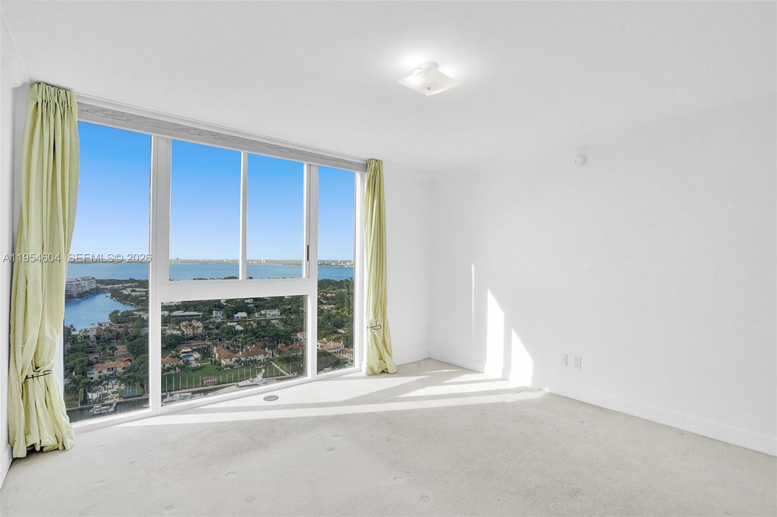 4775 Collins Avenue, Unit 3007 Miami Beach, FL 33140 - Photo 29 of 60 a view of a room with a large window