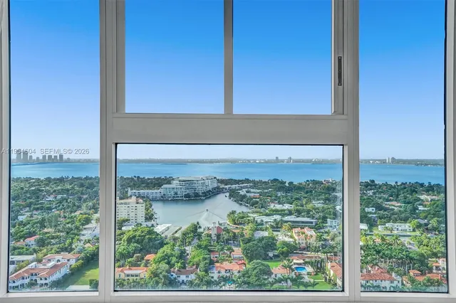 a view of a room with rack on the wall and a window