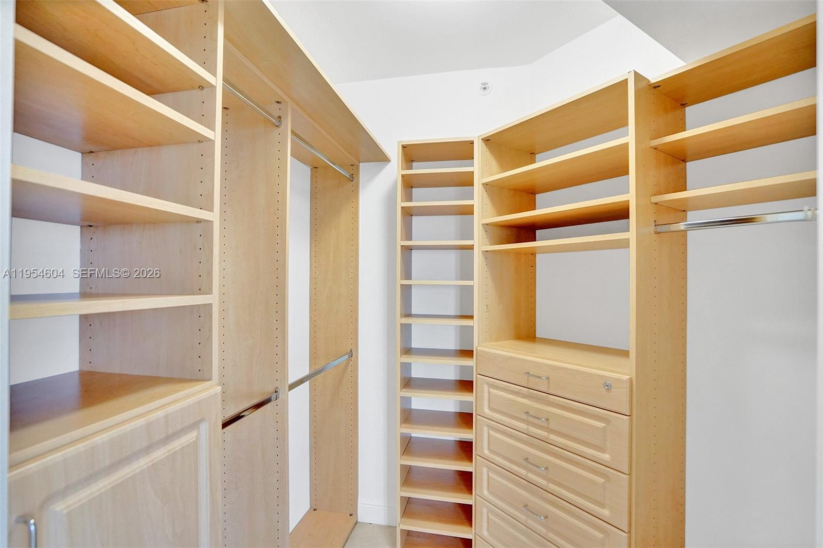 4775 Collins Avenue, Unit 3007 Miami Beach, FL 33140 - Photo 32 of 60 a view of walk in closet with empty racks