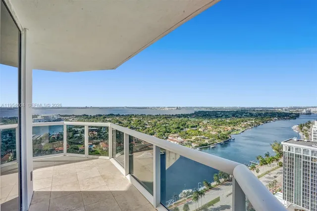 a view of a balcony with lake view and mountain view
