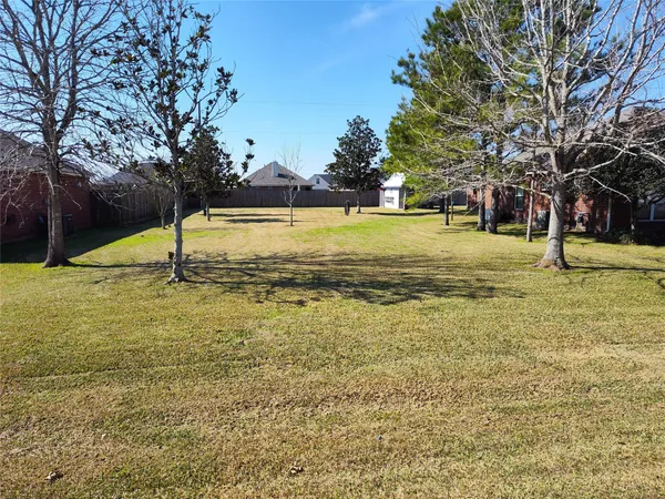 a view of a swimming pool with a yard