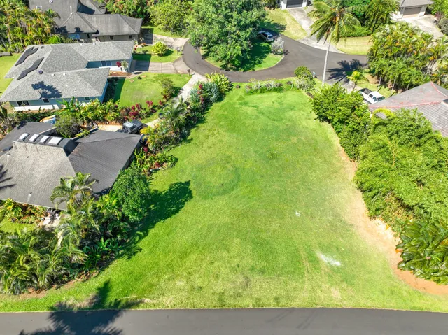 an aerial view of residential house with an outdoor space