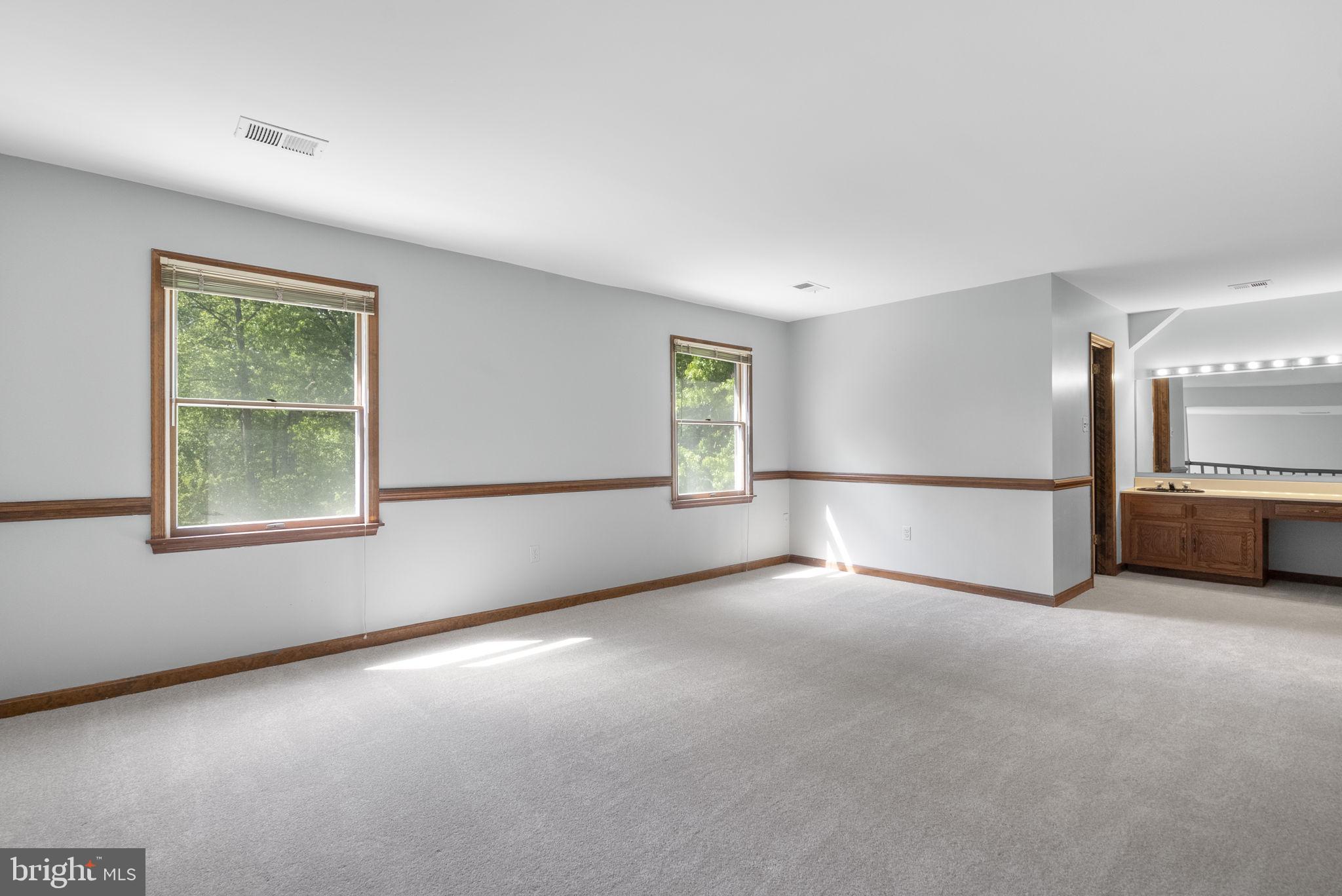 15220 Redgate Drive Silver Spring, MD 20905 - Photo 31 of 65 a view of an empty room with a window