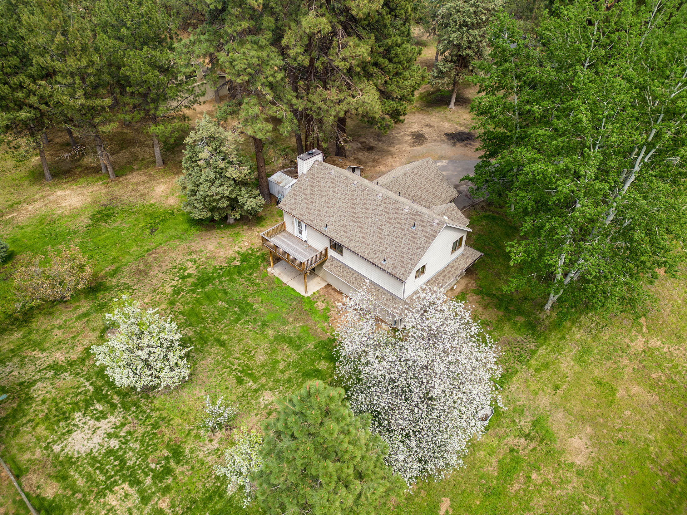 60603 Woodside Road Bend, OR 97702 - Photo 8 of 36 a view of a house with a yard