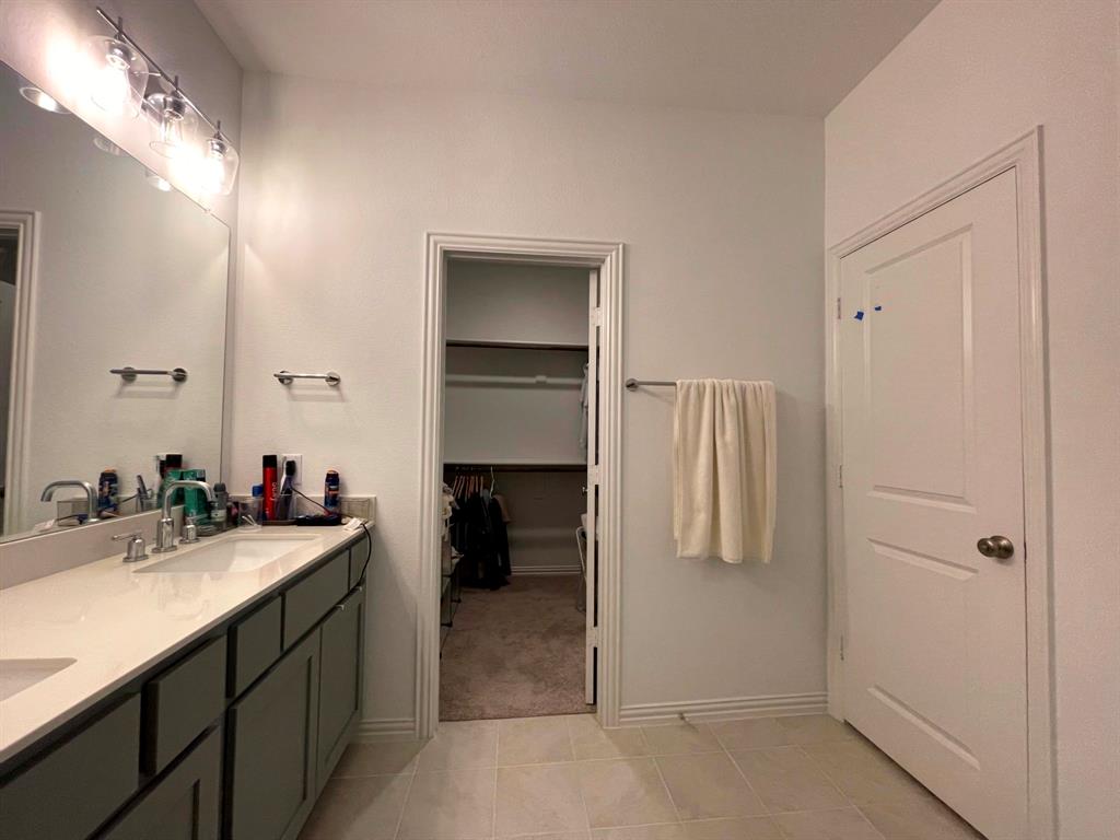 5514 Union Street Sachse, TX 75048 - Photo 18 of 25 a bathroom with a sink and a mirror