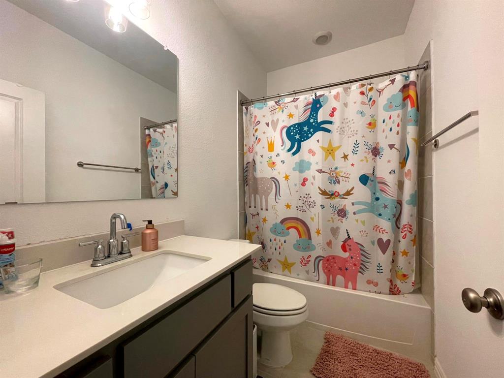 5514 Union Street Sachse, TX 75048 - Photo 22 of 25 a bathroom with a sink and a mirror
