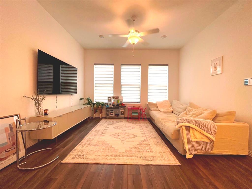 5514 Union Street Sachse, TX 75048 - Photo 4 of 25 a living room with furniture and a flat screen tv
