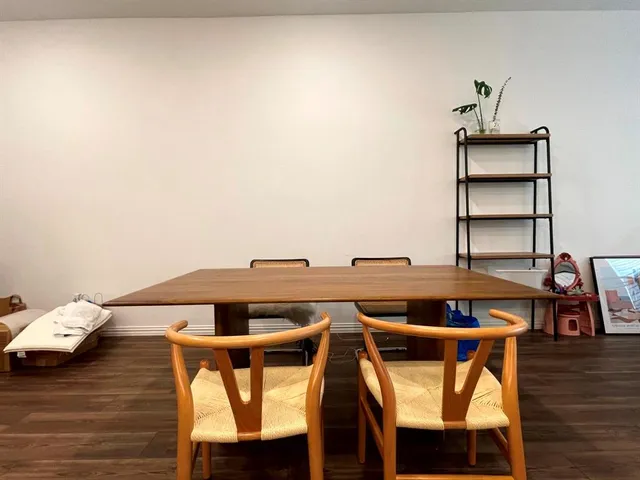 a view of a dining room with furniture and a wooden floor