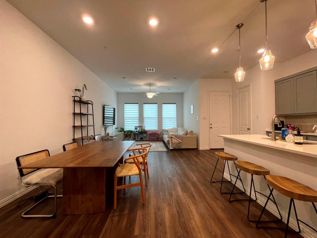5514 Union Street Sachse, TX 75048 - Photo 10 of 25 a view of a dining room with furniture and a wooden floor