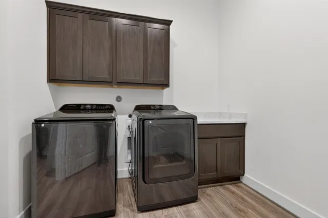 a large bed sitting in a bedroom next to a window