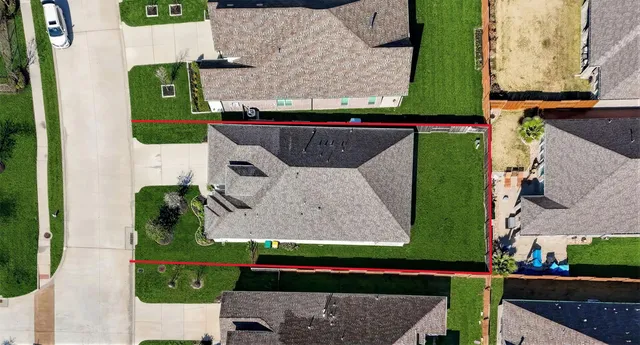 an aerial view of a house with a ocean view