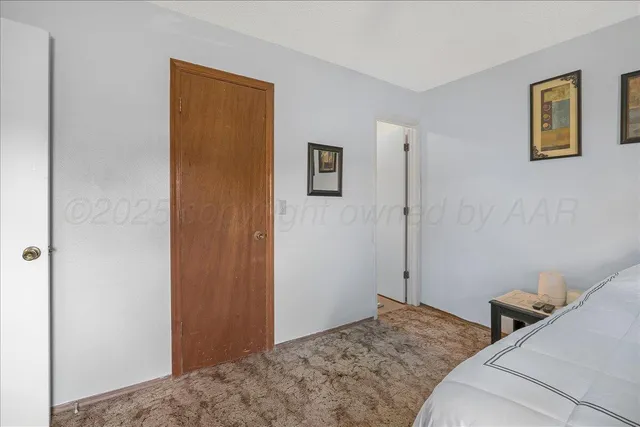 a bathroom with a sink a toilet and shower curtain