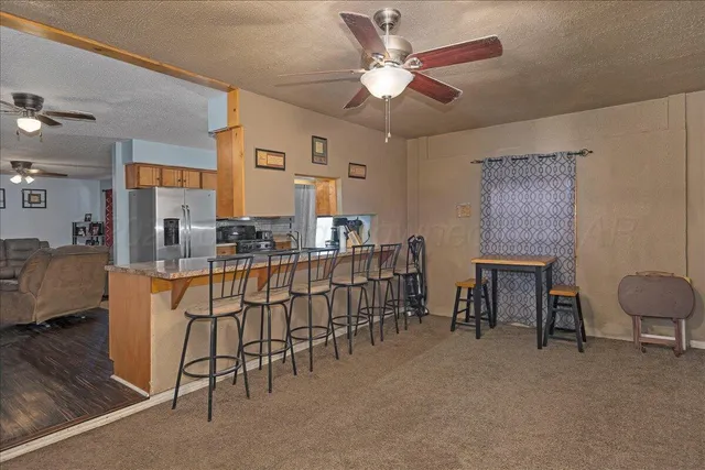 a view of a livingroom with furniture and a chandelier