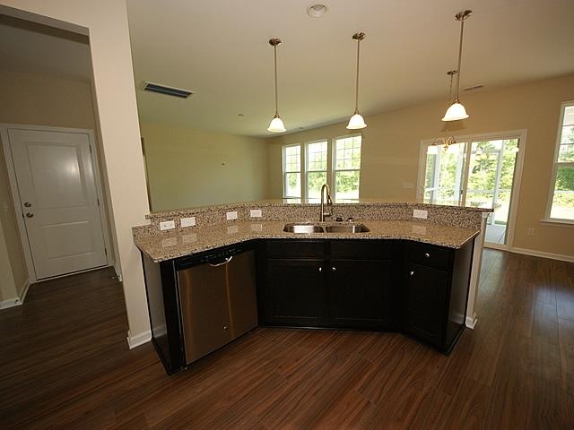 304 Spectrum Road Summerville, SC 29486 - Photo 5 of 17 Kitchen island, open to family room