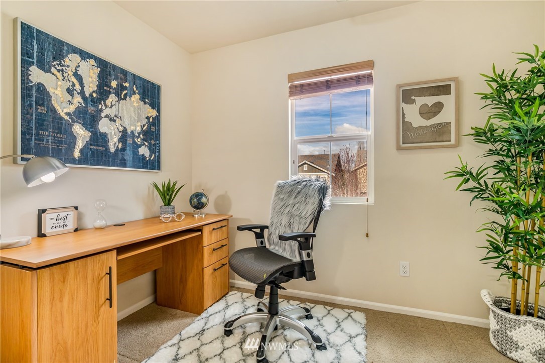 4114 167th Place Southeast Bothell, WA 98012 - Photo 21 of 38 a view of a workspace with furniture and a potted plant