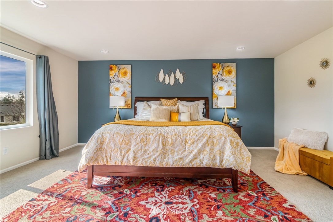 4114 167th Place Southeast Bothell, WA 98012 - Photo 23 of 38 a bedroom with a bed and wooden floor