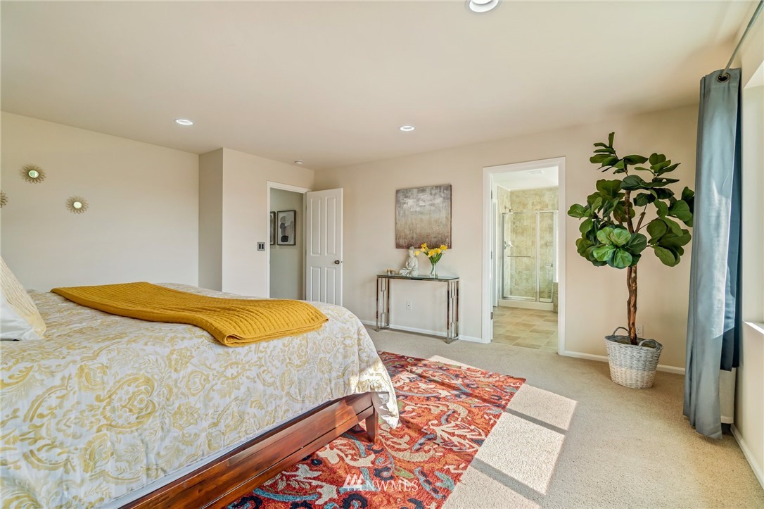 4114 167th Place Southeast Bothell, WA 98012 - Photo 24 of 38 a bedroom with a bed and a couch