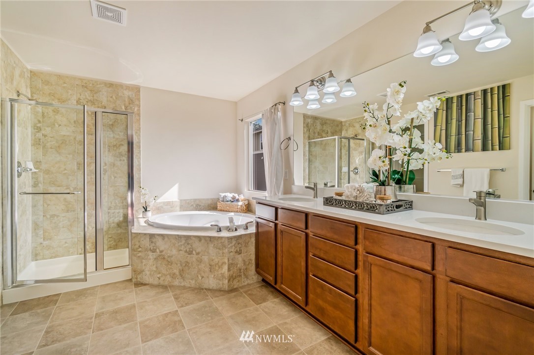 4114 167th Place Southeast Bothell, WA 98012 - Photo 25 of 38 a spacious bathroom with a tub sink and mirror